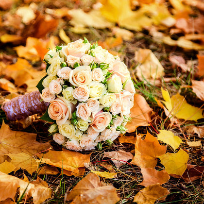 bride's bouquet of mini roses in autumn part of October weddings ideas