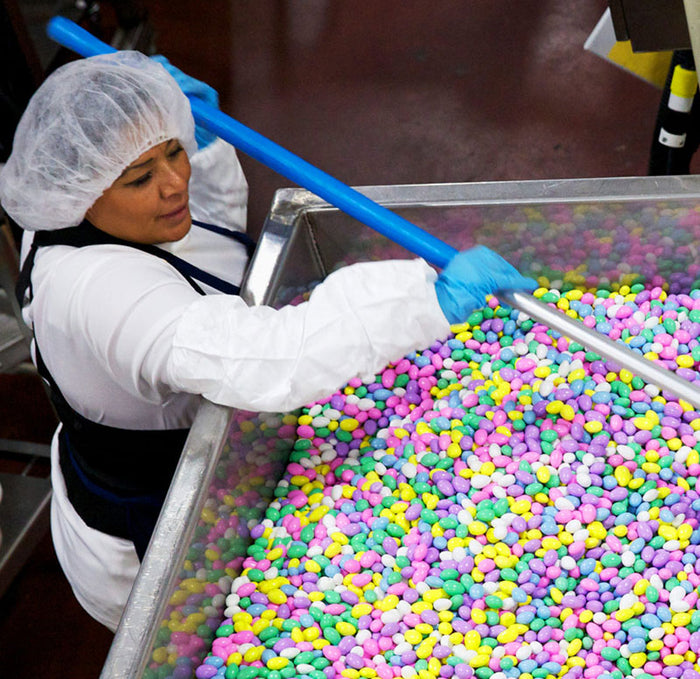 woman making candy